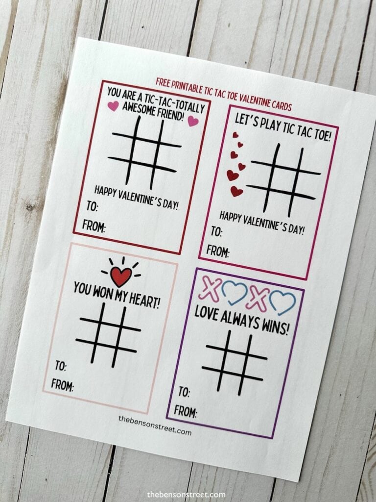 A printed sheet with four valentine cards on it with tic tac toe boards