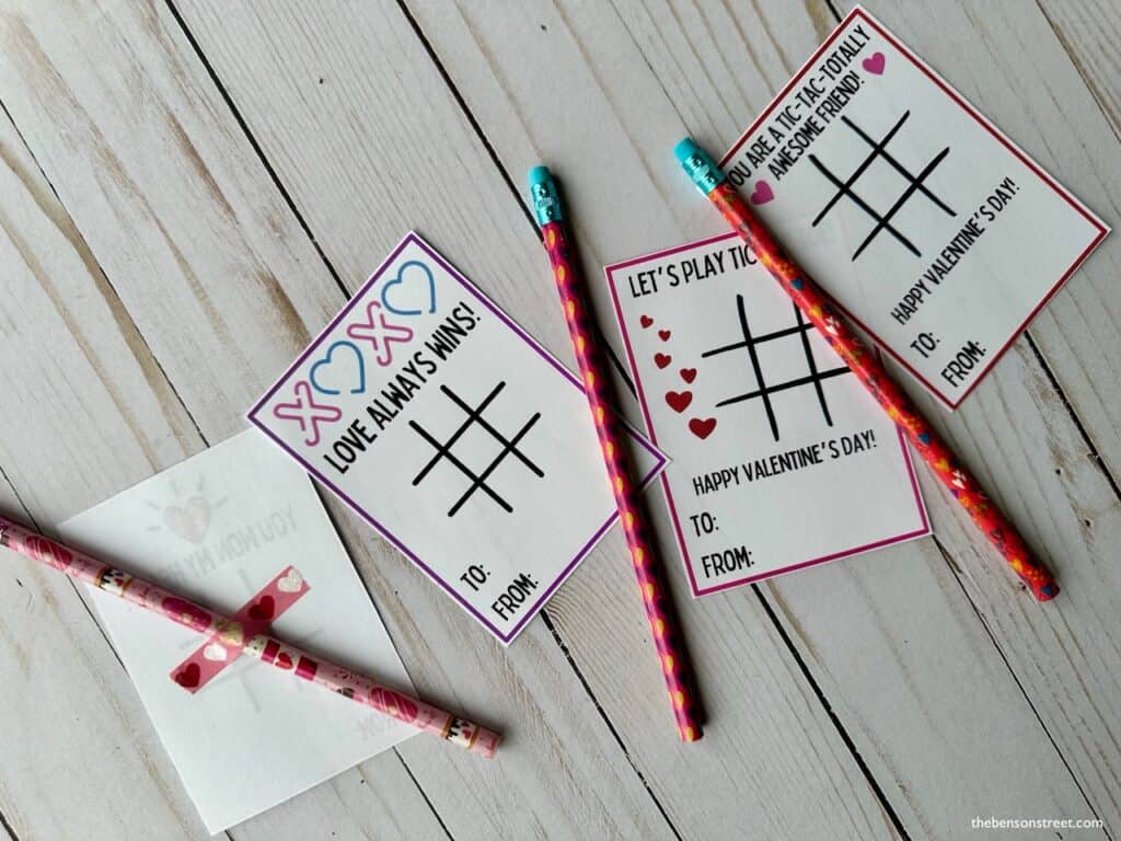 Taping a pencil to the back of a tic tac toe printable valentine card