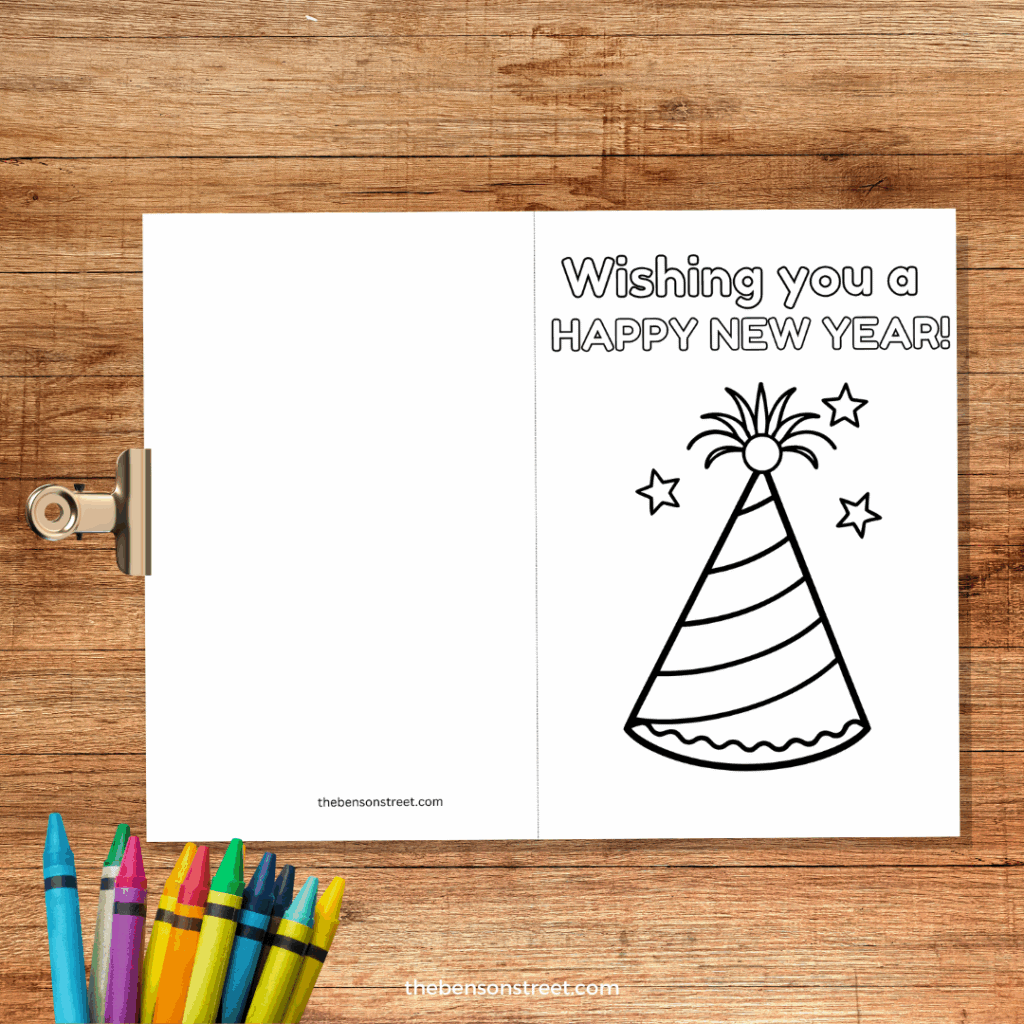Wishing you a happy new year coloring cards on a clipboard with crayons