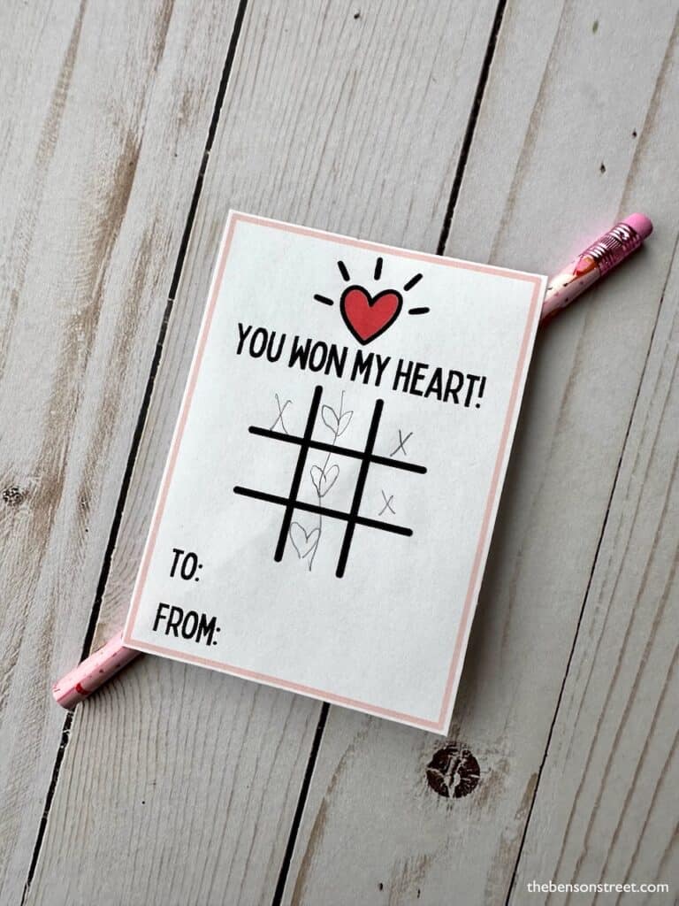 You won my heart tic tac toe valentine with x's and hearts drawn in on the game board