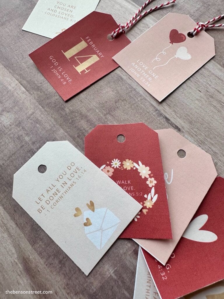 A bunch of red and pink valentine tags