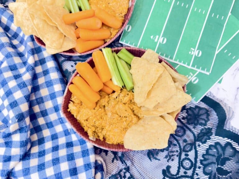 Football shaped chicken dip with buffalo sauce and dippers