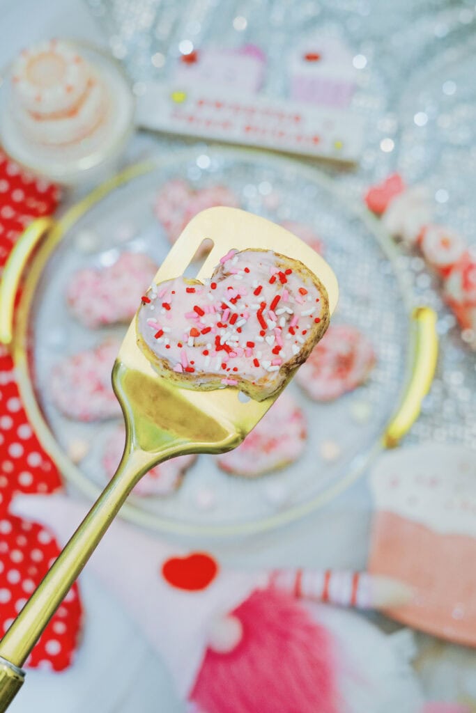 Heart cinnamon rolls on a gold spatula