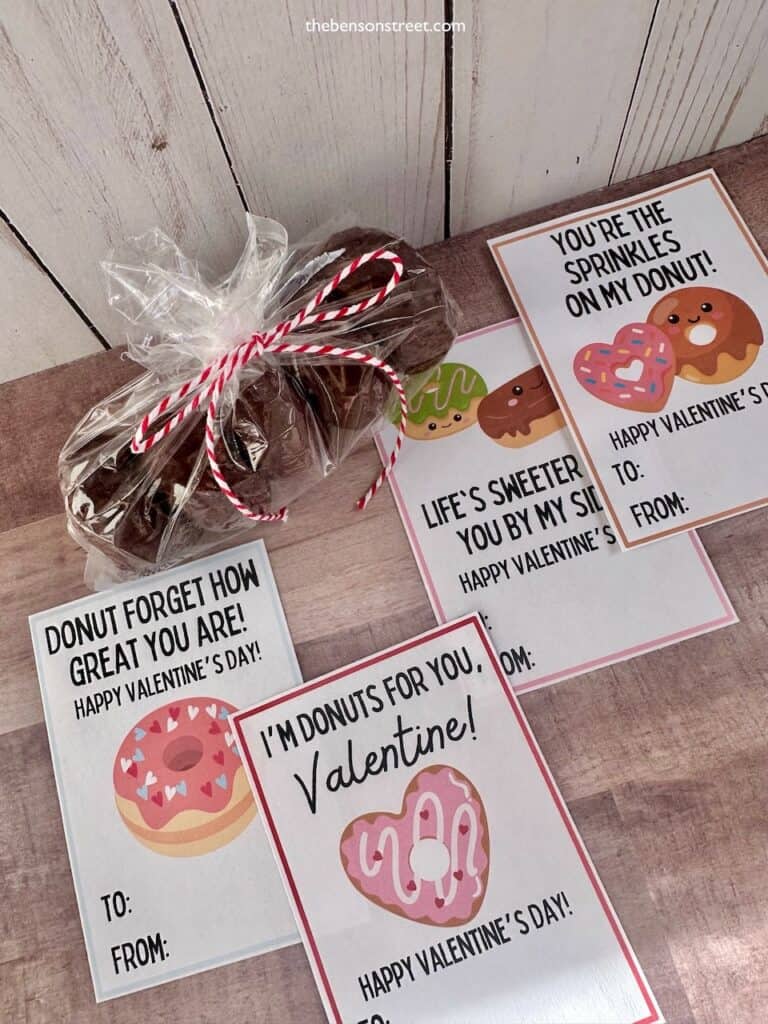 Overhead shot of donut valentines with a bag of mini donuts