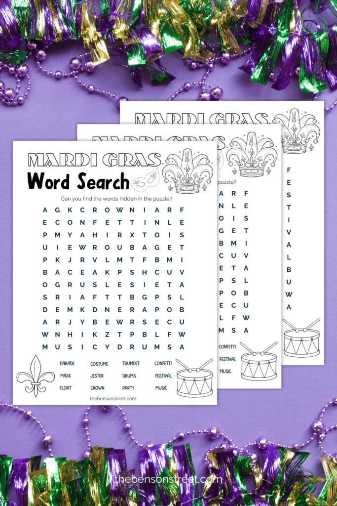Stack of printed out word search puzzles on a purple background 