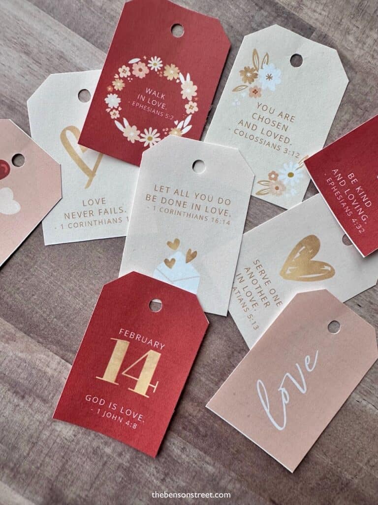 Up close shot of cutout tags with scripture verses for Valentine's Day