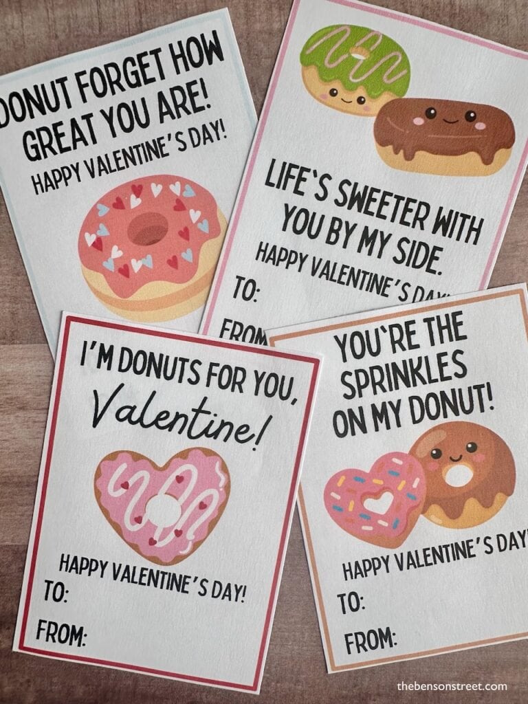 Up close shot of four valentine's day cards with donut messages