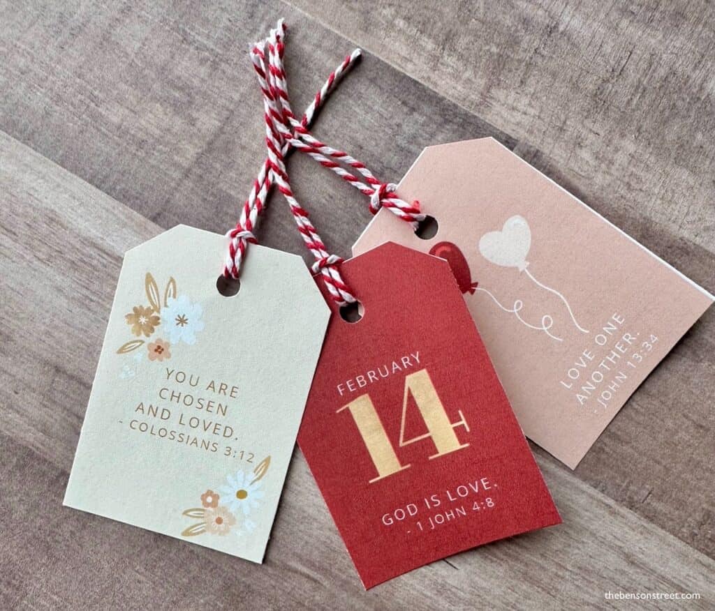 Up close shot of pretty tags with scripture verses for Valentine's Day