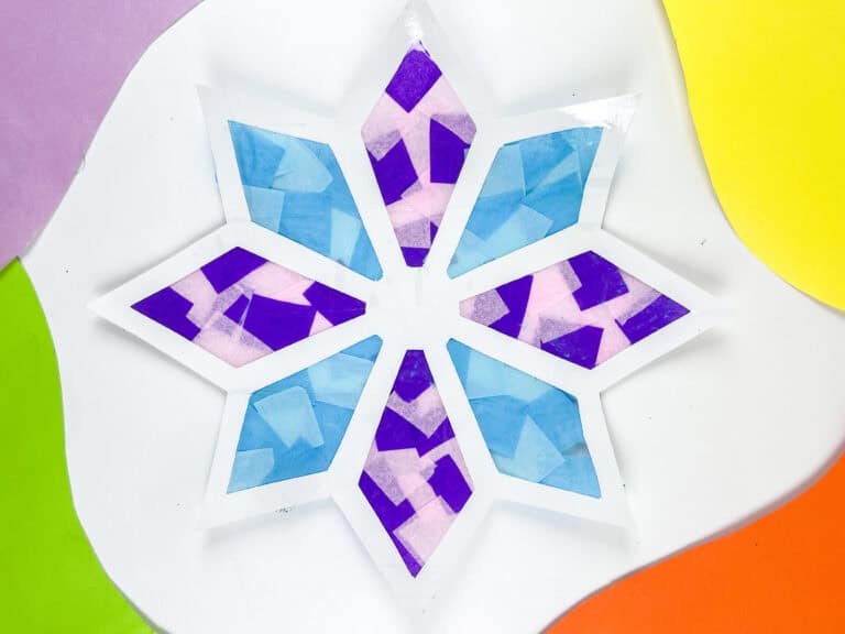 Using tissue paper squares to make a snowflake