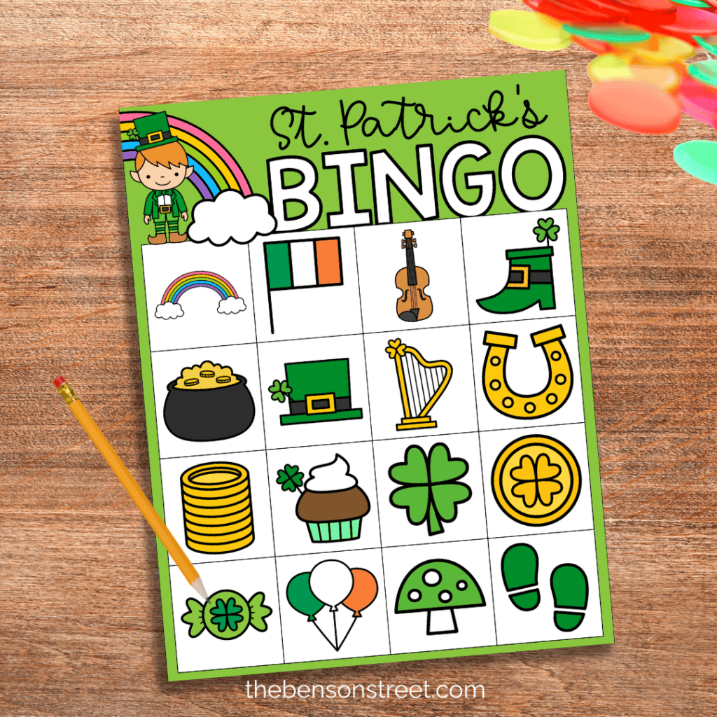 Free Printable bingo board with a pencil and chips on top