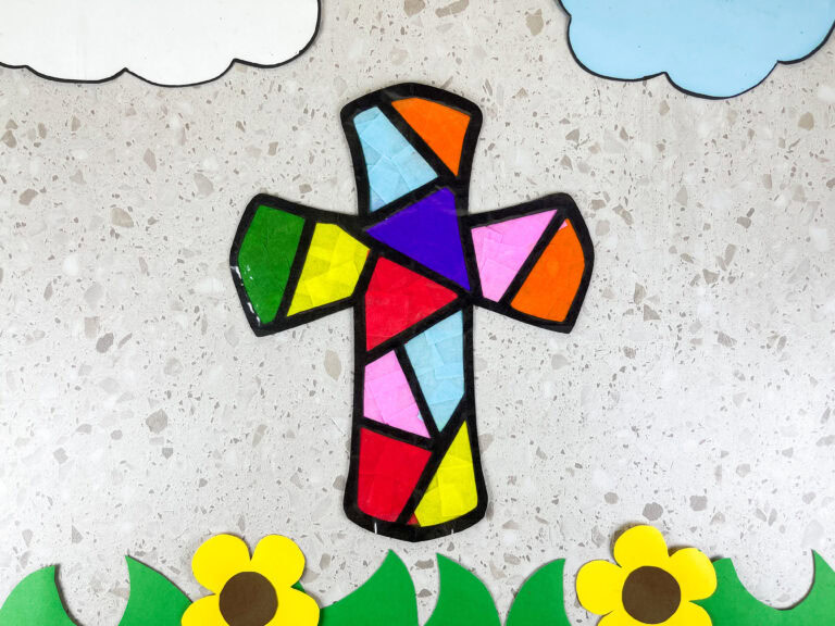 Overhead shot of a colorful stained glass cross craft