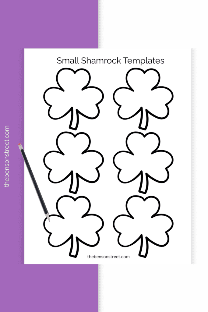 Page of three leaf clovers with a pencil on top