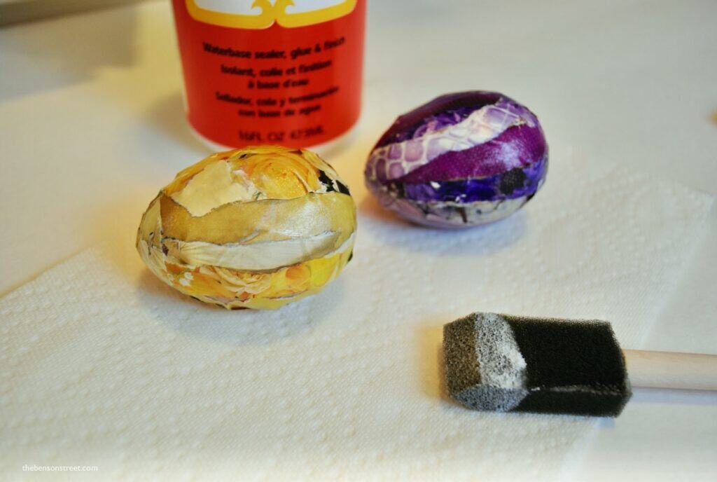 Finishing two mod podge easter eggs with a collage style