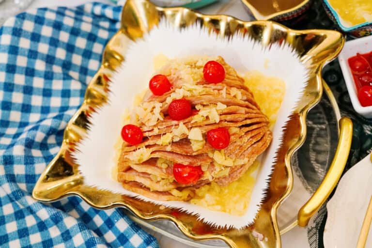 Overhead shot of a spiral cut ham with cherries and pineapple on top