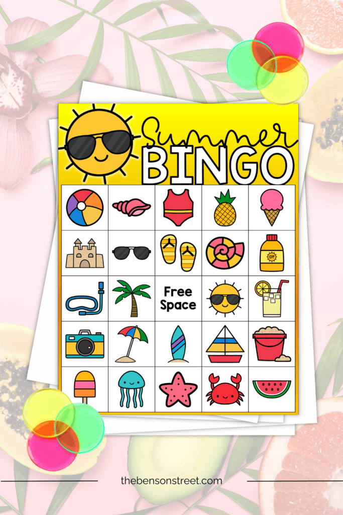 Summer bingo board on a stack of papers with bingo chips around