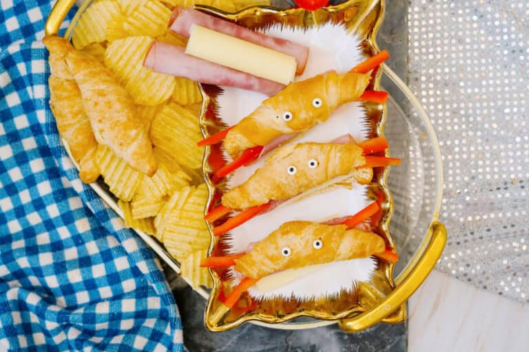 Candy eyes, red pepper legs on crab croissant shaped sandwiches