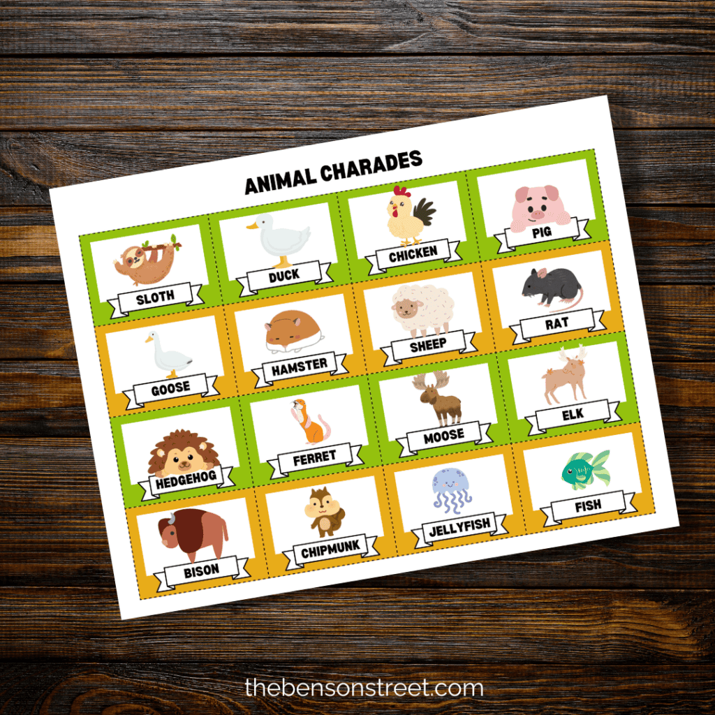 Page of printable animal charades cards on a wood background