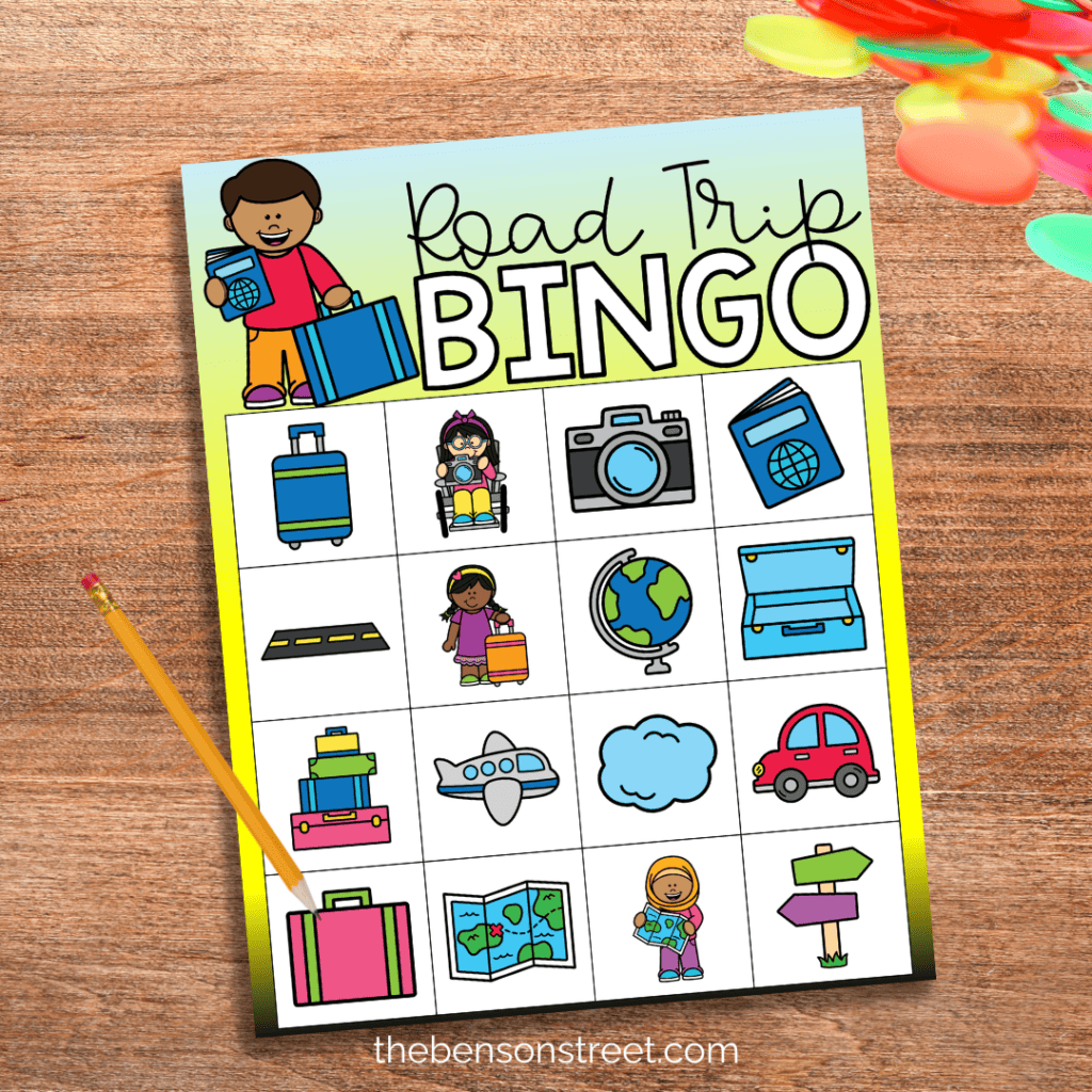 A Road trip bingo board with bingo markers and a pencil on top