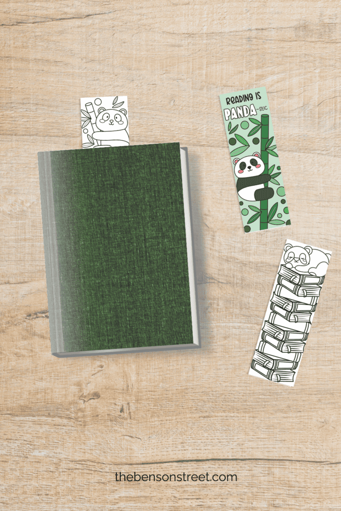 A book with a bookmark sticking out with a panda on top