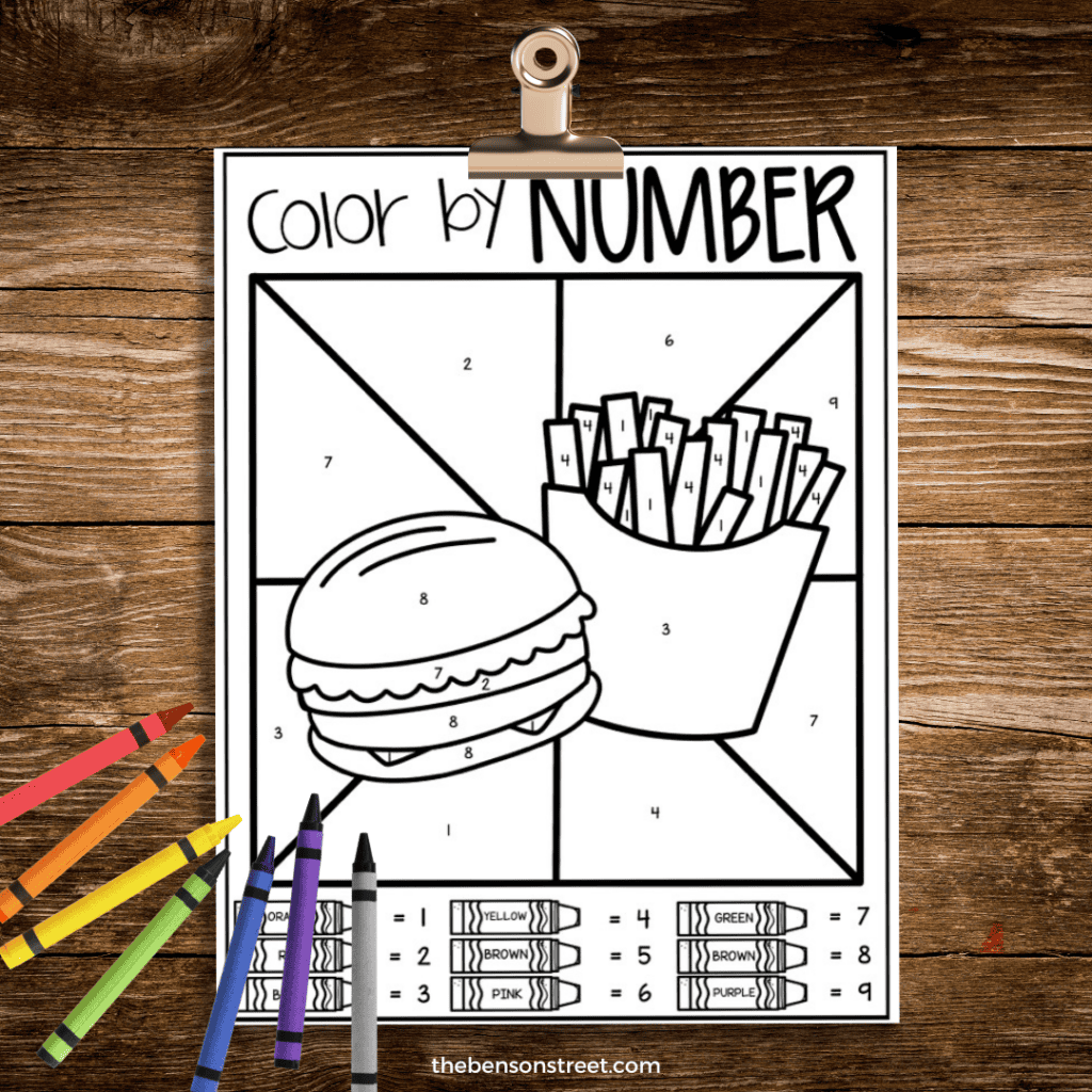 Burger and fries color by number pages with crayons on top