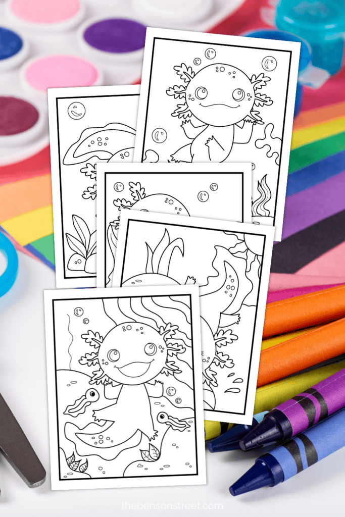 Five different designs of Axolotl coloring sheets on a background of art supplies