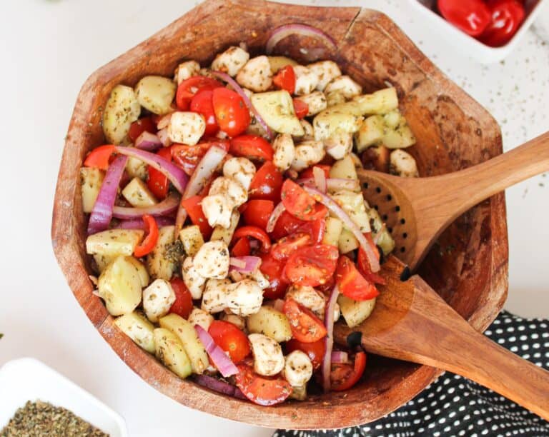 Wood bowl with a delicious summer salad inside