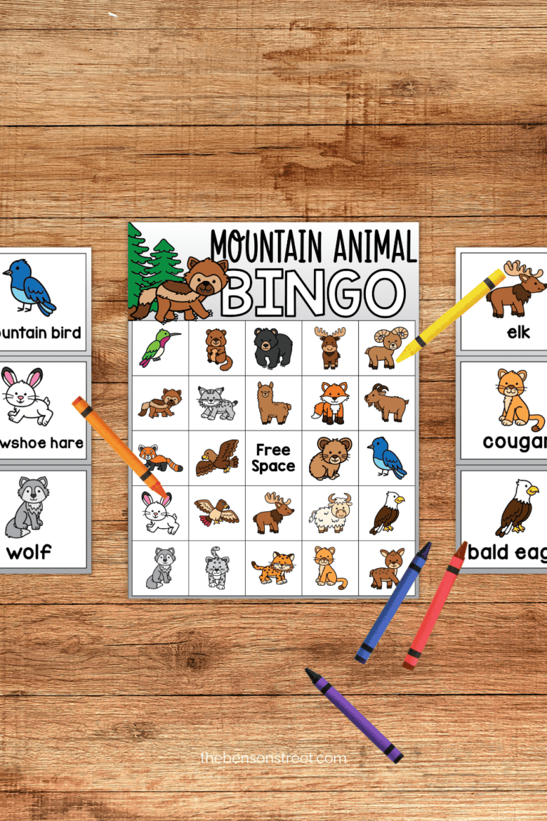 A mountain animal bingo board with calling cards and crayons on the side