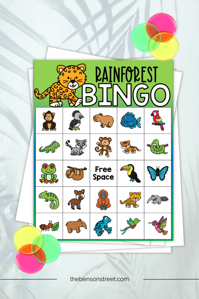 A rainforest bingo board with bingo chips on top