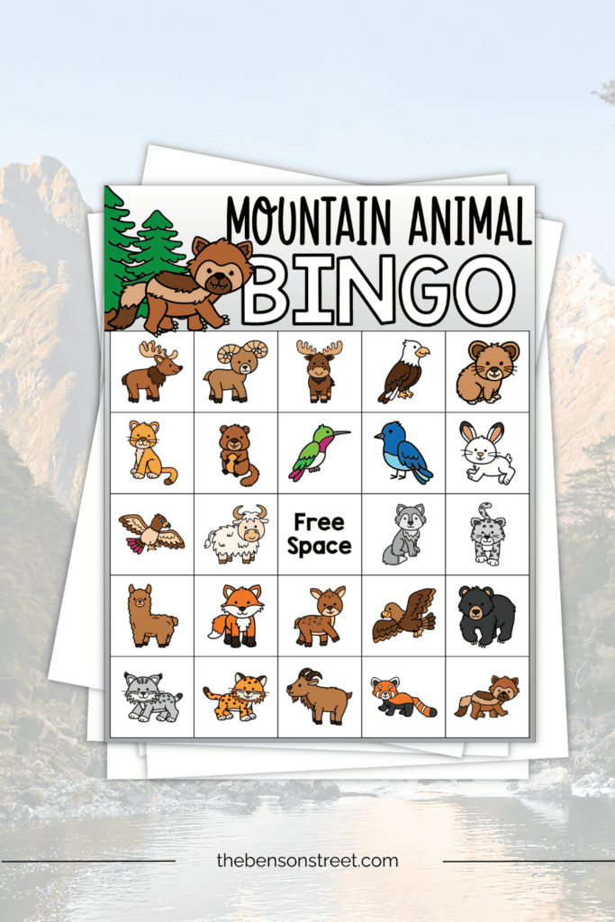 A stack of papers with a mountain animal bingo board on top of the stack