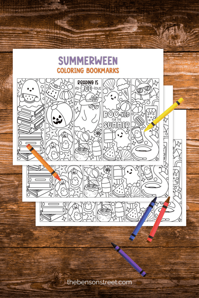 A table with coloring bookmarks to celebrate summerween with crayons laying around