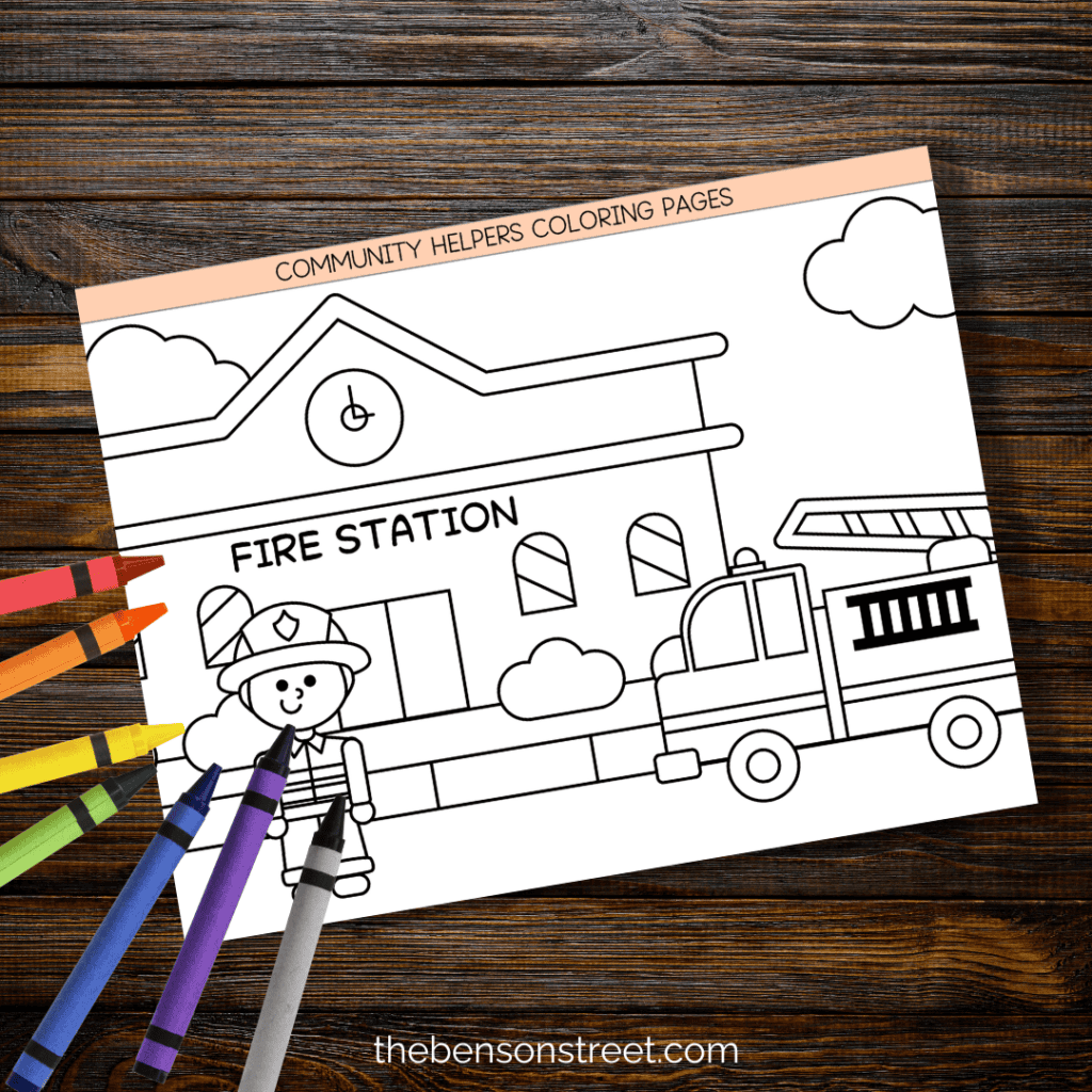 Fireman Community helper coloring sheet with crayons on top