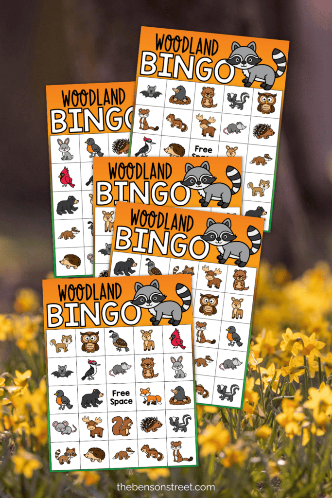 Five woodland bingo boards on a floral background