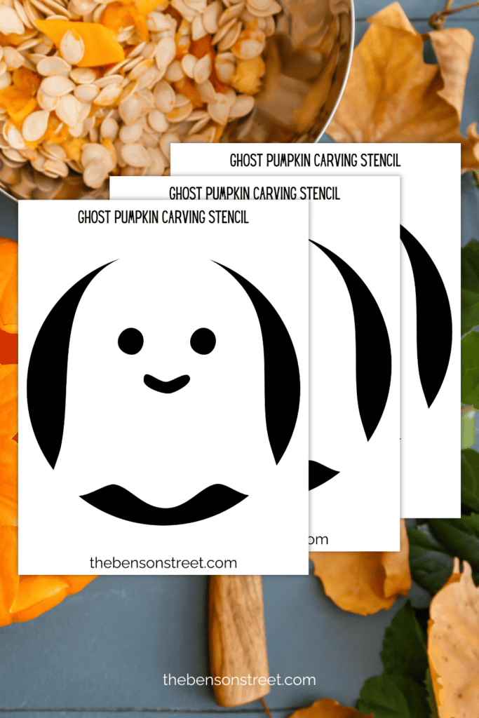 Three printed out ghost pumpkin carving stencil sheets with a pumpkin carving background 