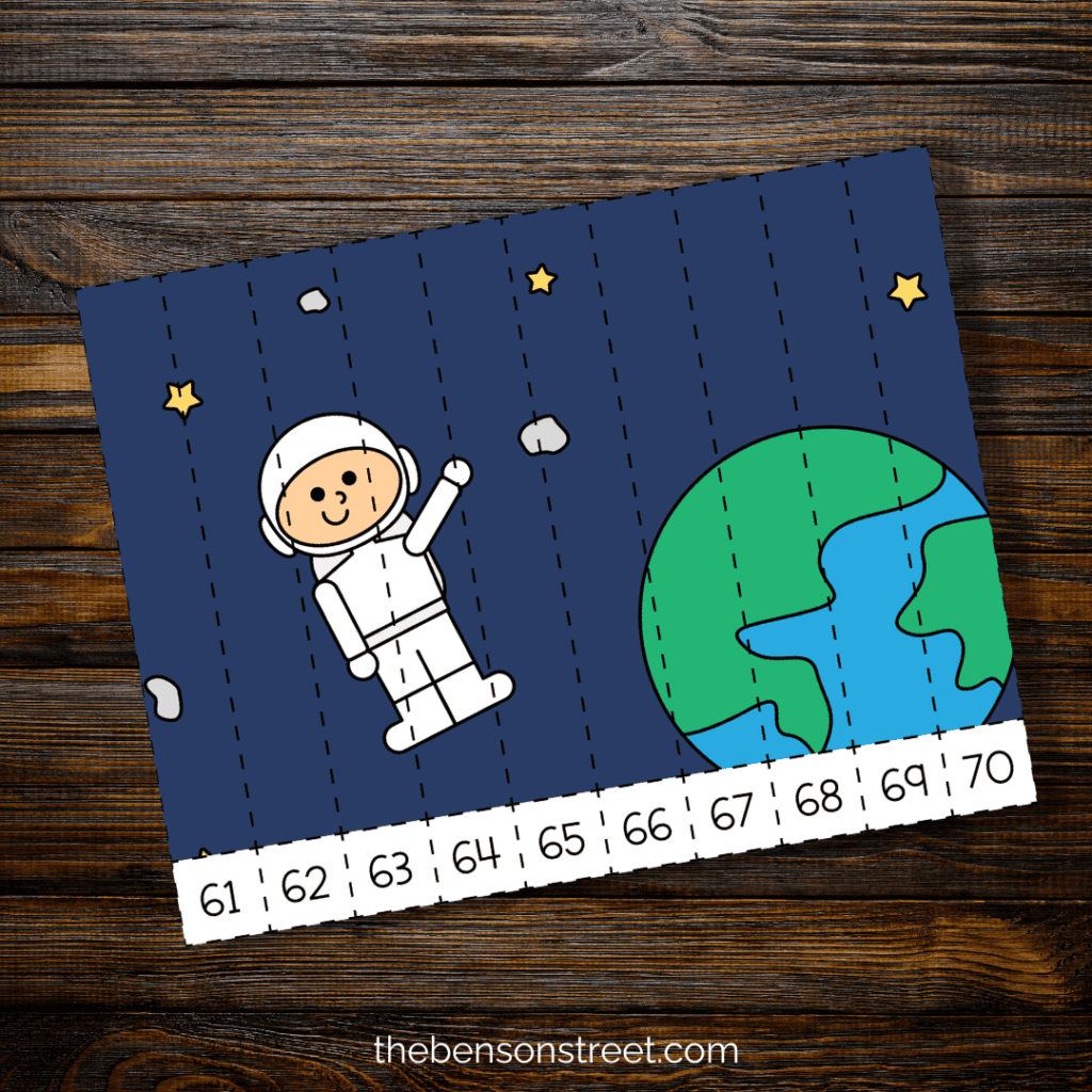 Astronaut in space with earth by him on a number puzzle sheet