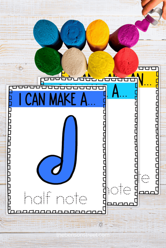 Music note playdough mats on a table with playdough on top
