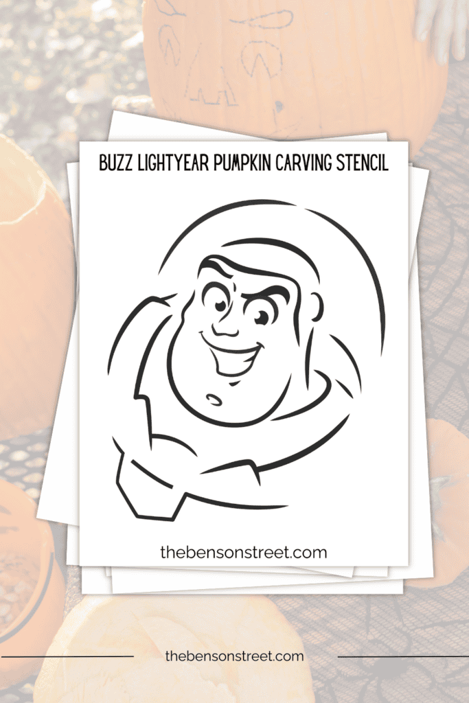 A stack of papers with a buzz lightyear themed pumpkin stencil on top