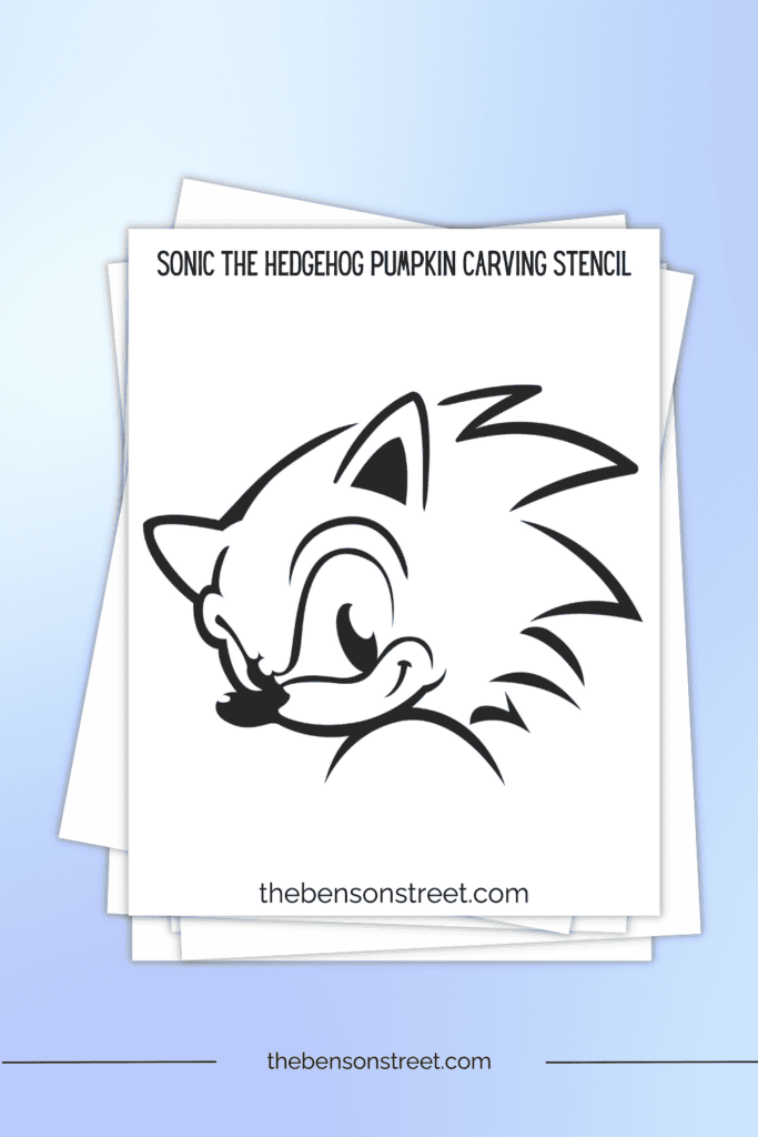 A stack of papers with a printable stencil featuring sonic the hedgehogs face