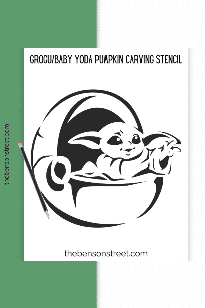 A stencil for carving a grogu halloween jack o'lantern with a pencil on top of the stencil