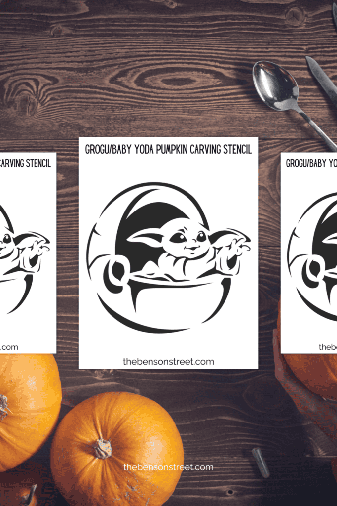 A table with star wars grogu pumpkin stencils and carving supplies