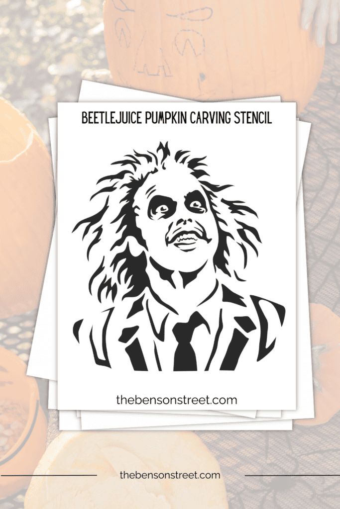Beetlejuice pumpkin template sheet on a stack of papers 
