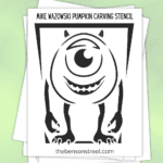 Stack of papers with a printable pumpkin template to carve mike from monster's inc.