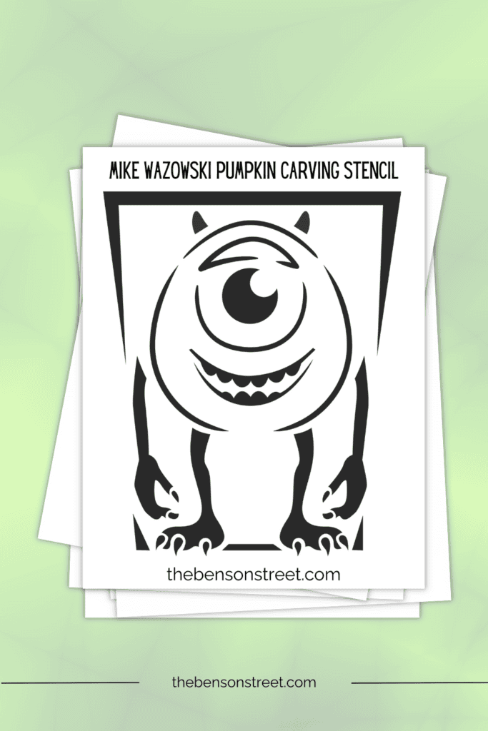 Stack of papers with a printable pumpkin template to carve mike from monster's inc.