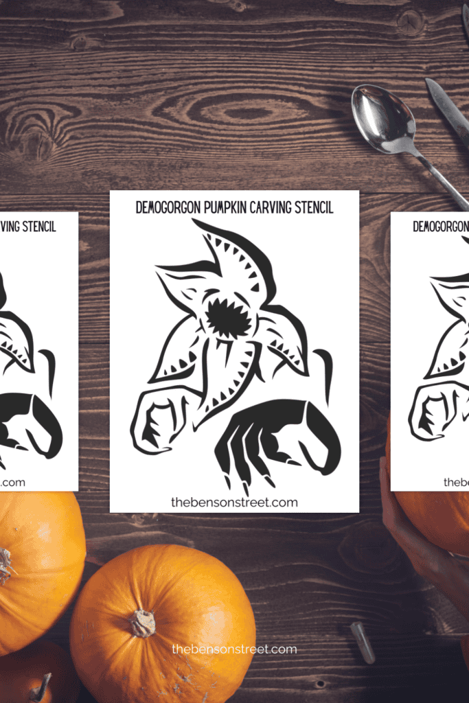 Three pages of demogorgon stencils on a table with carving supplies around
