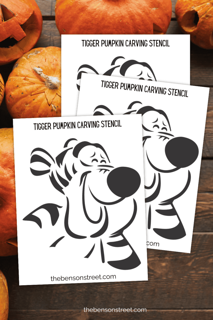 Tigger pumpkin carving stencils with pumpkins in the background 